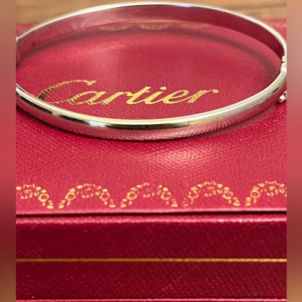 White gold bangle with two faced design .